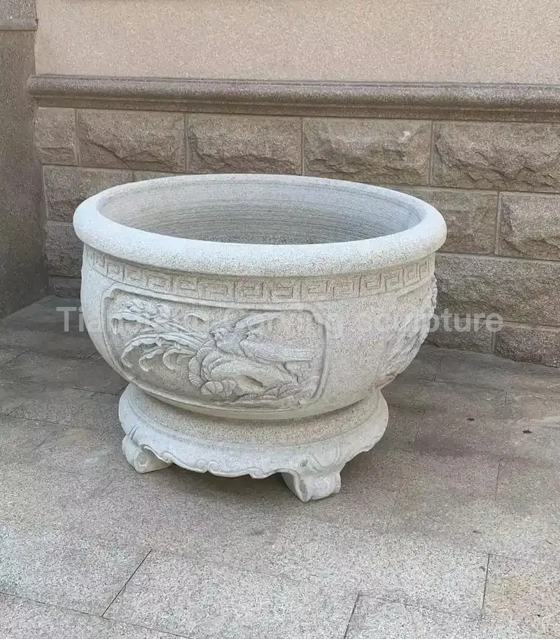 00ceaff9-7c77-4340-8e1a-92261d1d4671.webp Granite flower and bird pattern stone carving fish tank