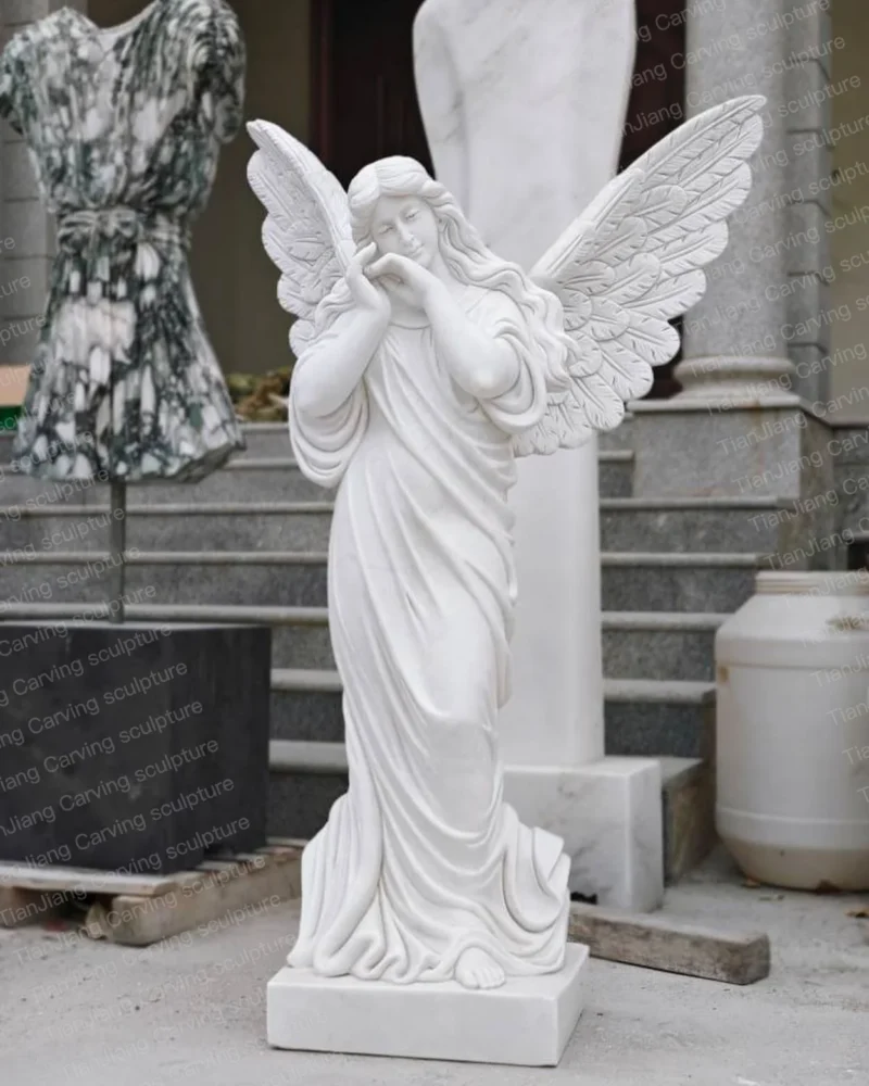 05cf3f90-493d-4916-a78f-d196d47e0533.webp White marble praying angel sculpture