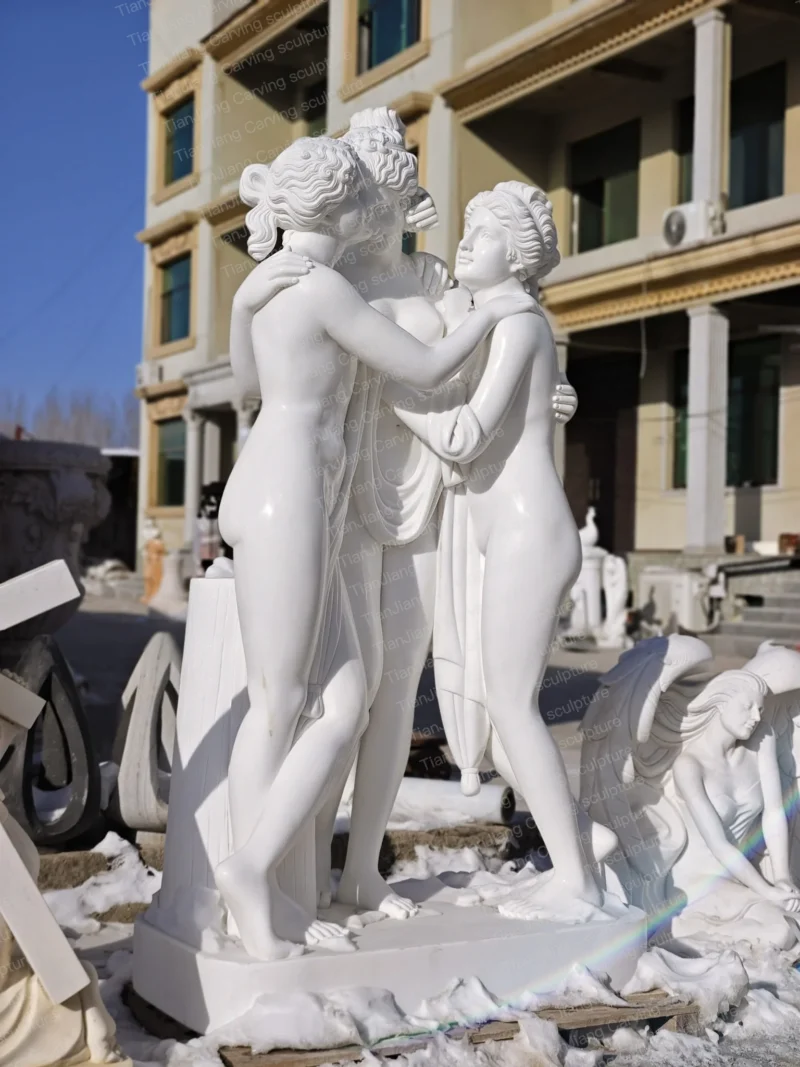 0e41a453-c7bd-4ff7-9787-de8f739295e3.webp White marble sculpture with the theme of "Three Graces"