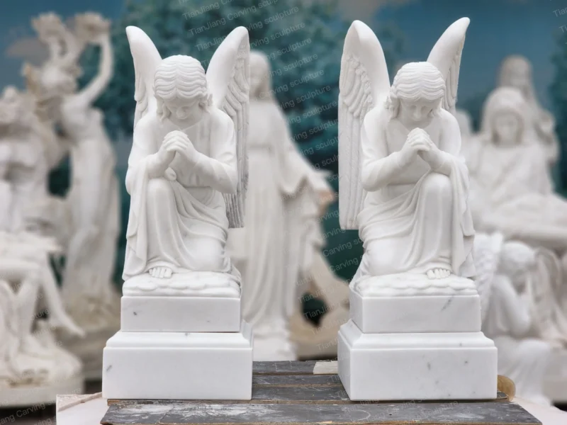 25d884e0-91a3-4b29-a8a3-86efead63748.webp White marble praying angel sculptures (pair)