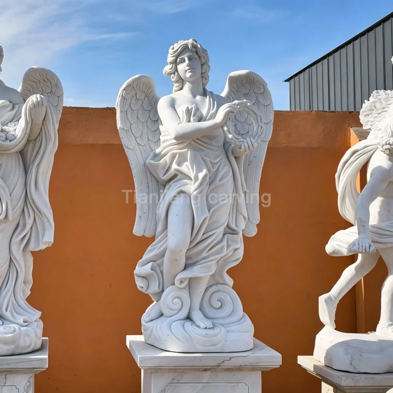 47b5aa7b-1f8e-4086-9f77-f0a5d25cb6ce.webp White marble European style angel stone carving with garland