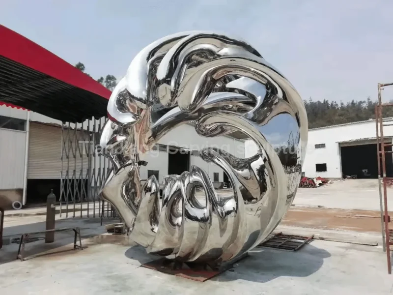 5b6913a8-d522-4d2e-9765-a10f4d2609b6.webp Stainless steel mirror abstract circular wave sculpture