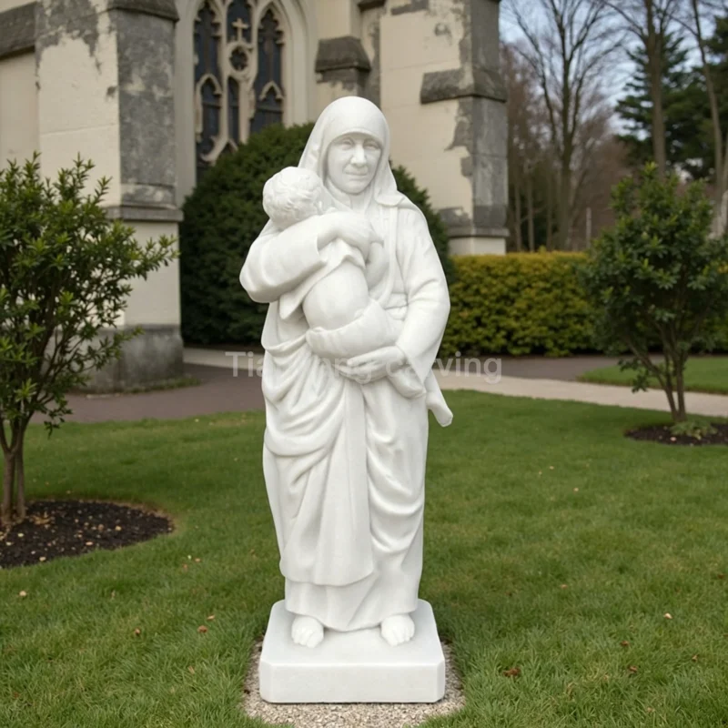 609e96fd-1ce9-4062-b264-3e11fe73b830.webp Marble Mother Teresa holding baby statue