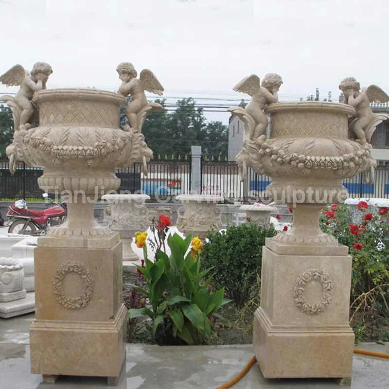 60a6df4f-07a8-44e0-af28-45b297df6613.webp Beige stone European style cherub stone carved flower bowl