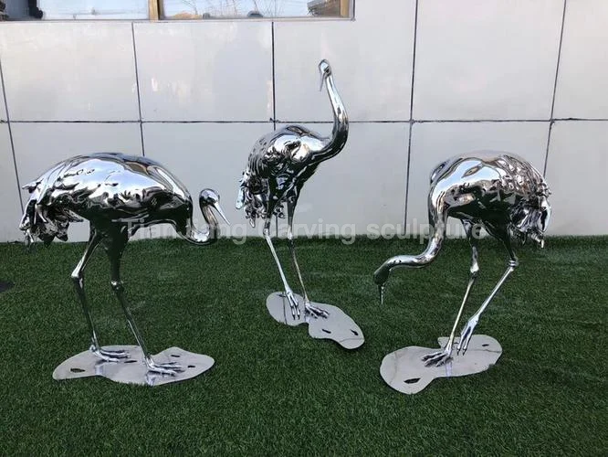 Stainless steel mirror crane sculpture