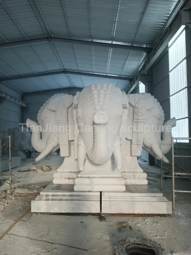 908d6143-a654-4ef1-83c7-dbf0dc523e12.webp Marble three-sided elephant head stone sculpture