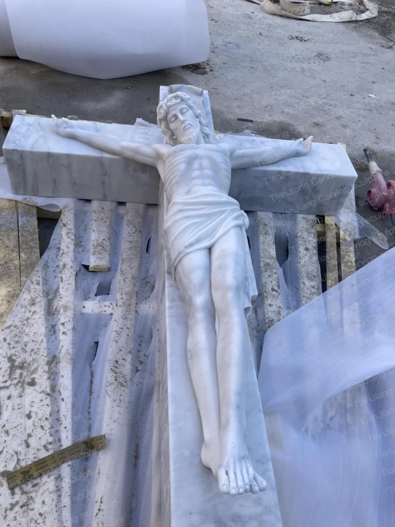 ab8ebfb6-c259-44c8-bbf8-b44f0c745c0f.webp White marble Jesus cross sculpture