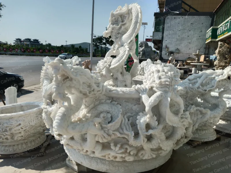 c1fd694f-3307-4e89-bf31-ac11ee899e05.webp White marble carved Nine Dragon Basin (Nine Dragon Urn)
