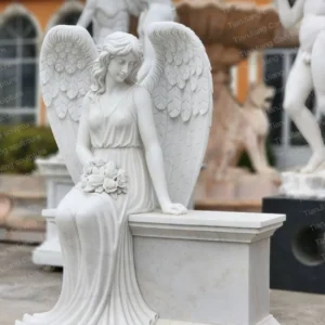 White marble seated angel sculpture