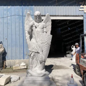 White marble sculpture of St. Michael the Archangel (stepping on a snake and wielding a sword)