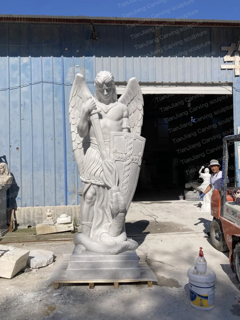 ec07fe98-72e5-4262-be8d-b33c9a2a4010.webp White marble sculpture of St. Michael the Archangel (stepping on a snake and wielding a sword)