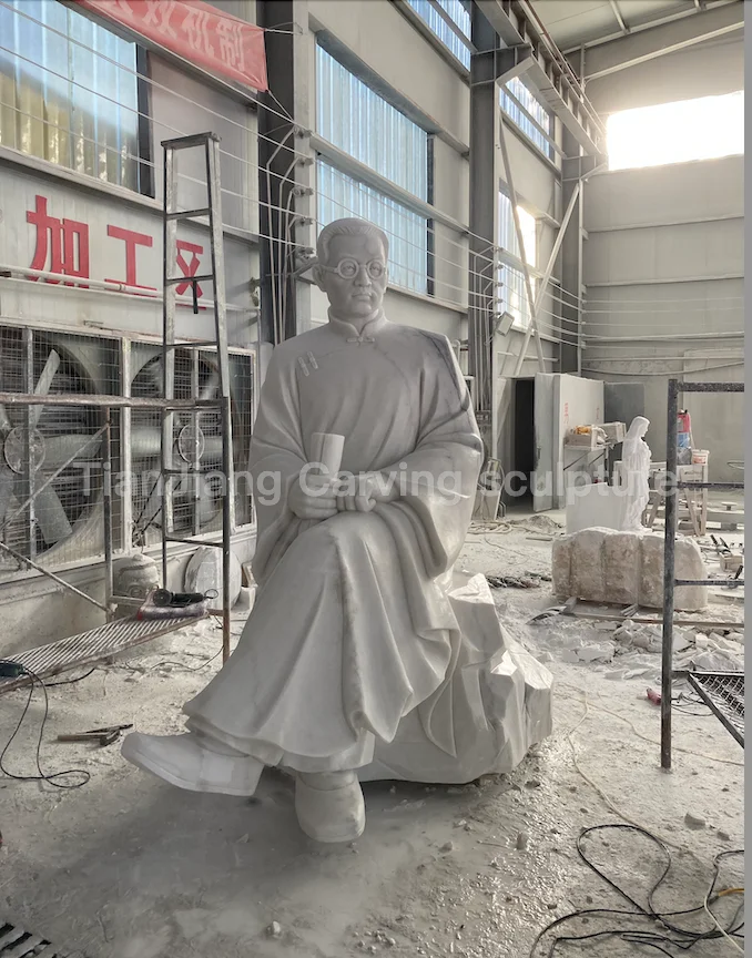 This product is a stone sculpture of a seated statue of Mr. Tao Xingzhi made of white marble.